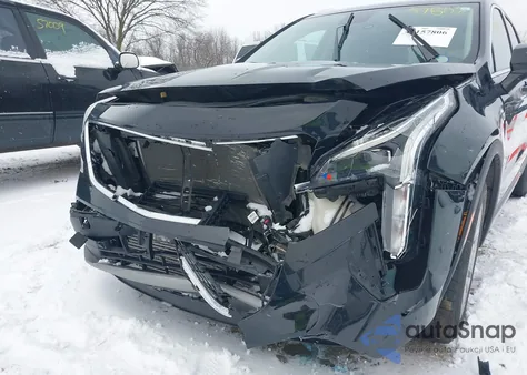 2022 Cadillac Xt4 Awd Premium Luxury from USA, damaged, VIN 1GYFZDR48NF127705